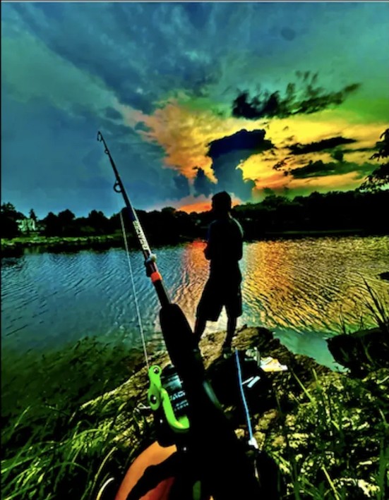 Fishing at sunset on the water
